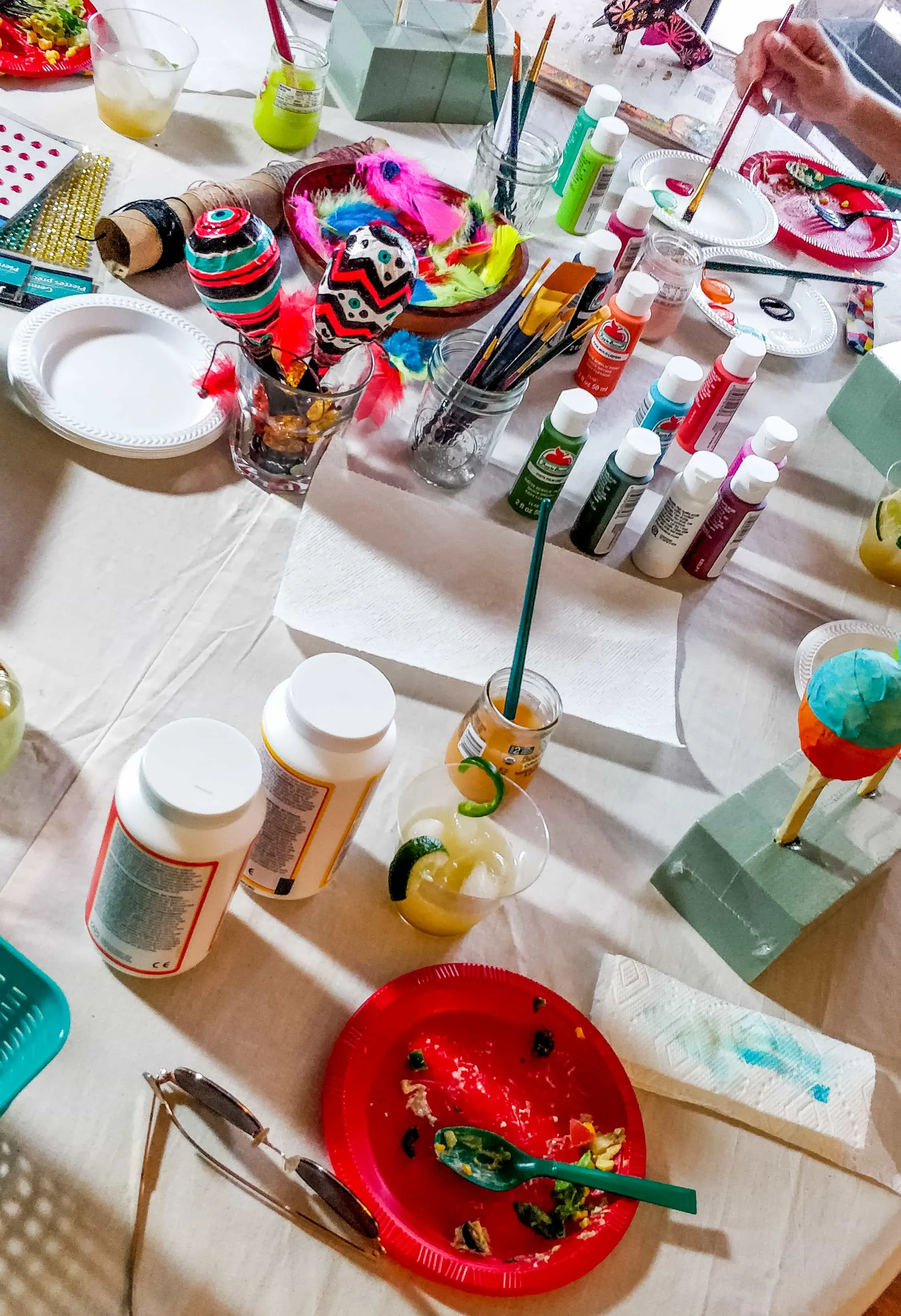Photo of Cinco de Mayo crafting table with paint, glue, and maracas